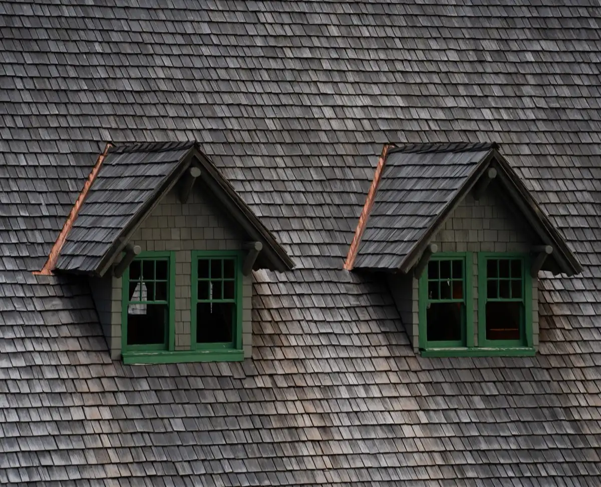 Dormers on a shingle roof in Thornton, CO, where step flashing and kickout flashing carry water past the walls