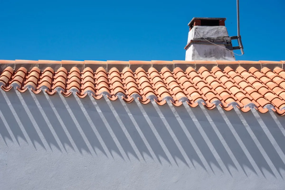 Roof ridge line and chimney on a home in Thornton, CO