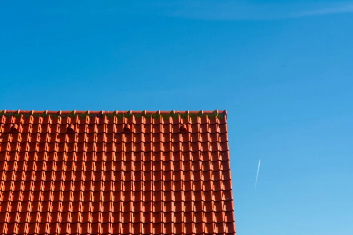 Tile roof gable in full sun, the kind of exposure that sets roof life in Thornton, CO